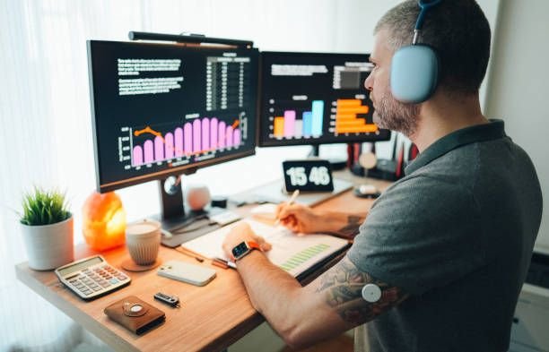 Man working remotely from home at standing desk